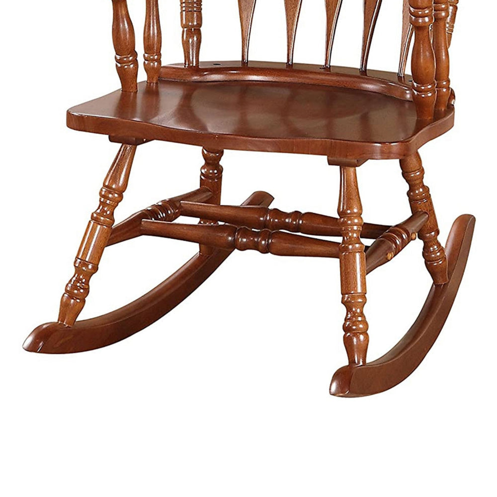 Wooden Rocking Chair with Armrests and Spindle Details Brown By Casagear Home AMF-59209