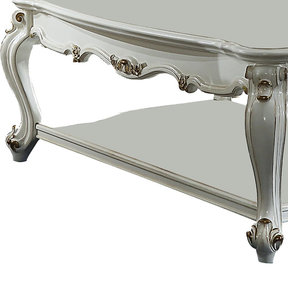 Traditional Style Wooden Coffee Table with Polyresin Carvings and Bottom Shelf White By Casagear Home AMF-83460