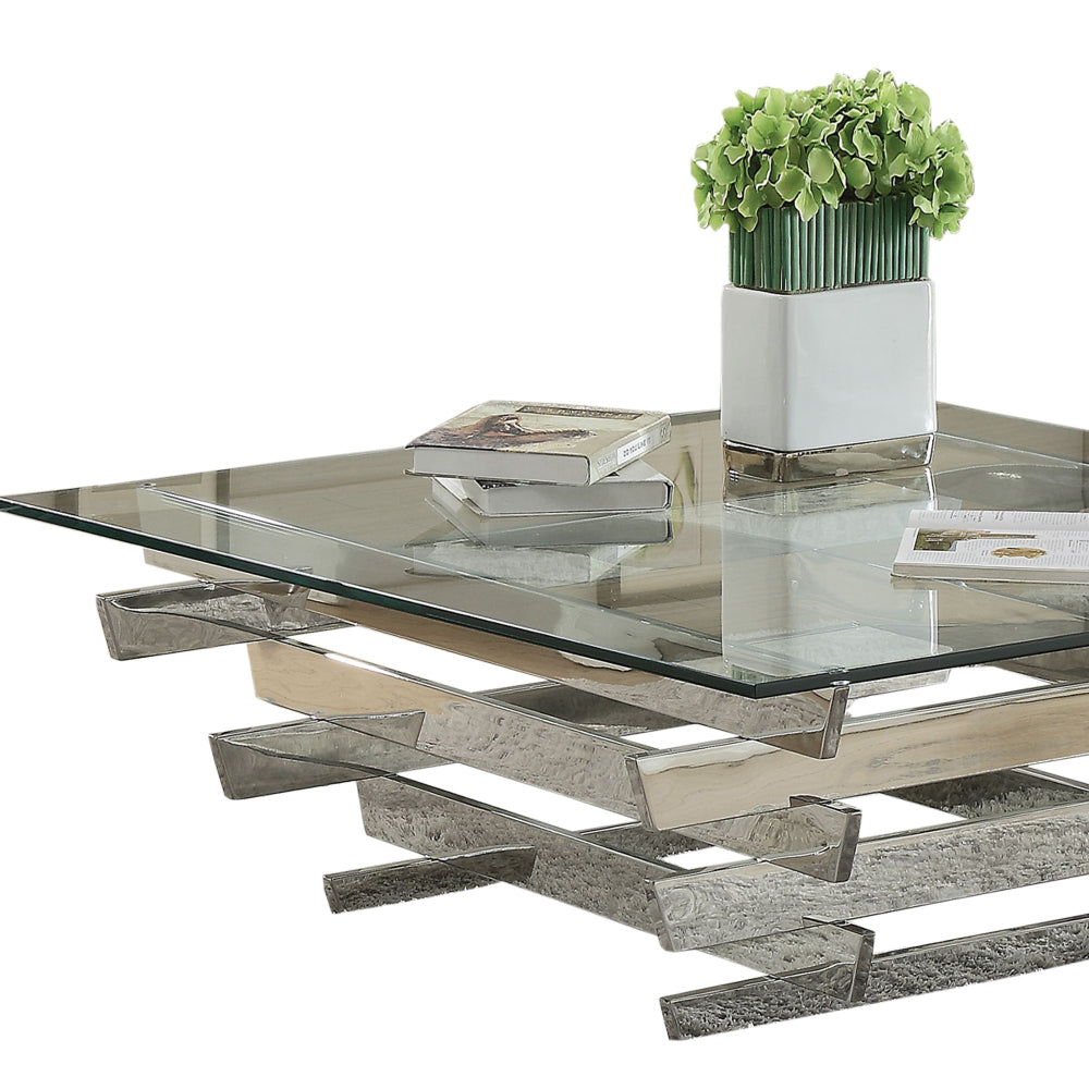 Glass Top Coffee Table with Asymmetrical Metal Base Silver and Clear By Casagear Home AMF-84610