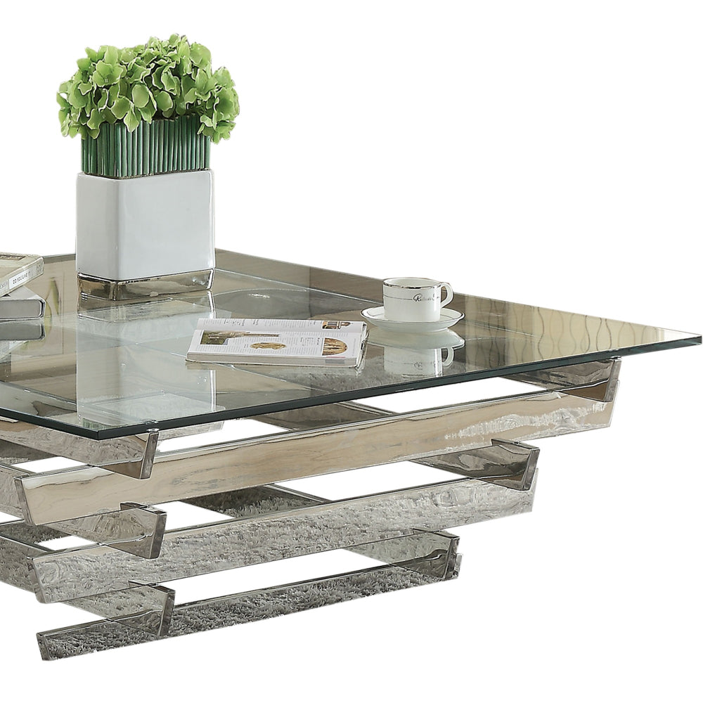 Glass Top Coffee Table with Asymmetrical Metal Base Silver and Clear By Casagear Home AMF-84610