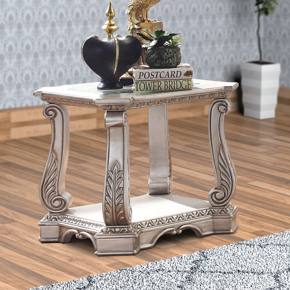 Antique Wooden End Table with Polyresin Engravings and Glass Top, Silver and Clear By Casagear Home