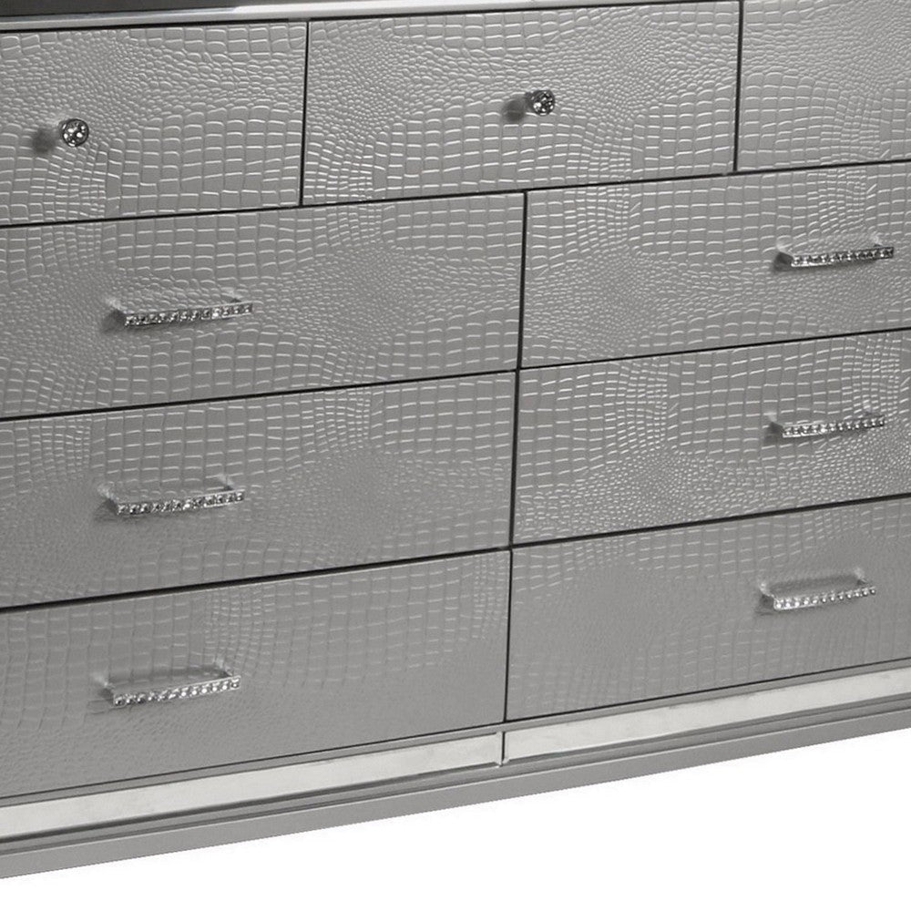 9 Drawer Wooden Dresser with Embossed Texture and Mirror Accents Silver By Casagear Home BM218220