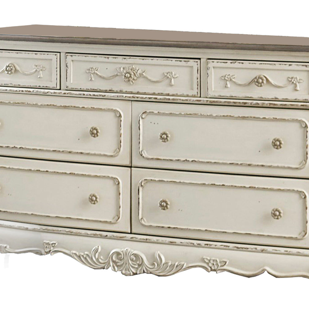 7 Drawer Dresser with Floral Motif Carving Details Antique White and Brown By Casagear Home BM219790