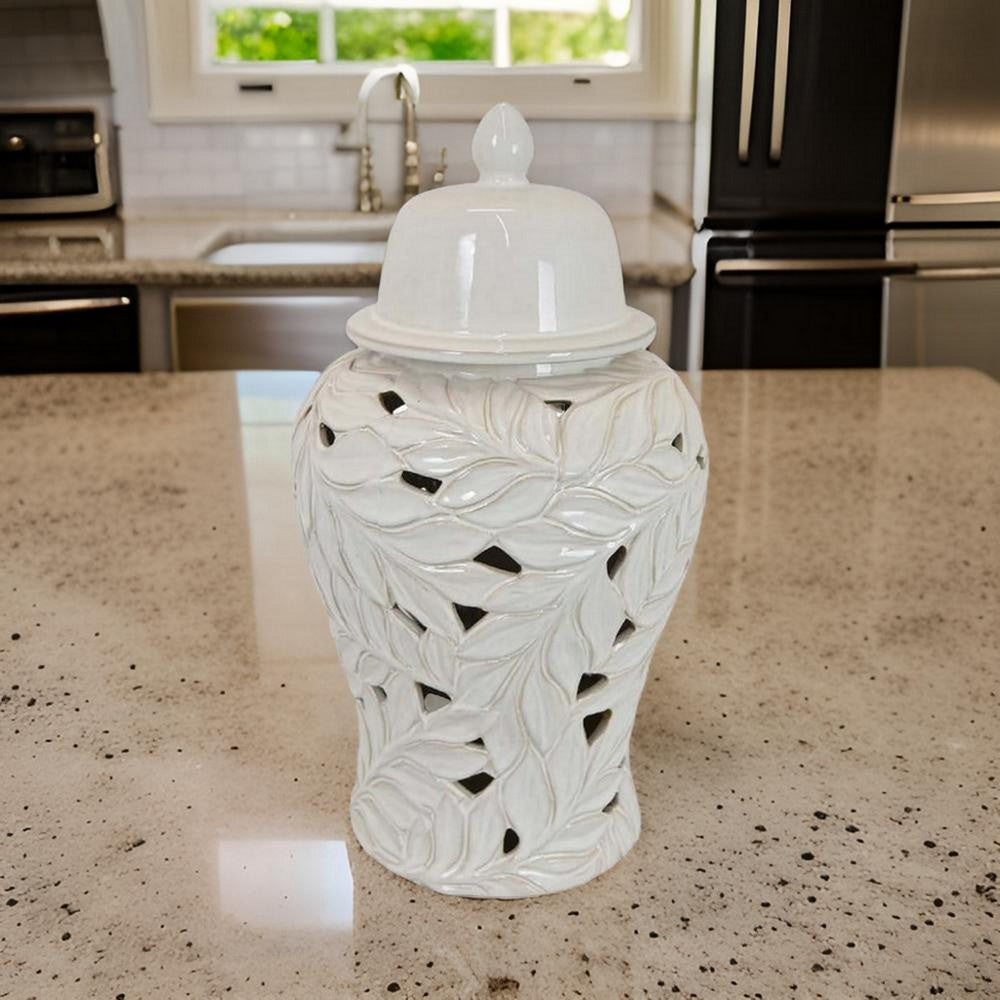 Heni 19 Inch Ceramic Temple Jar with Lid, Cut Out Leaf Motifs, White Finish By Casagear Home