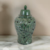 Heni 19 Inch Ceramic Temple Jar with Lid, Cut Out Leaf Motifs, Green Finish By Casagear Home